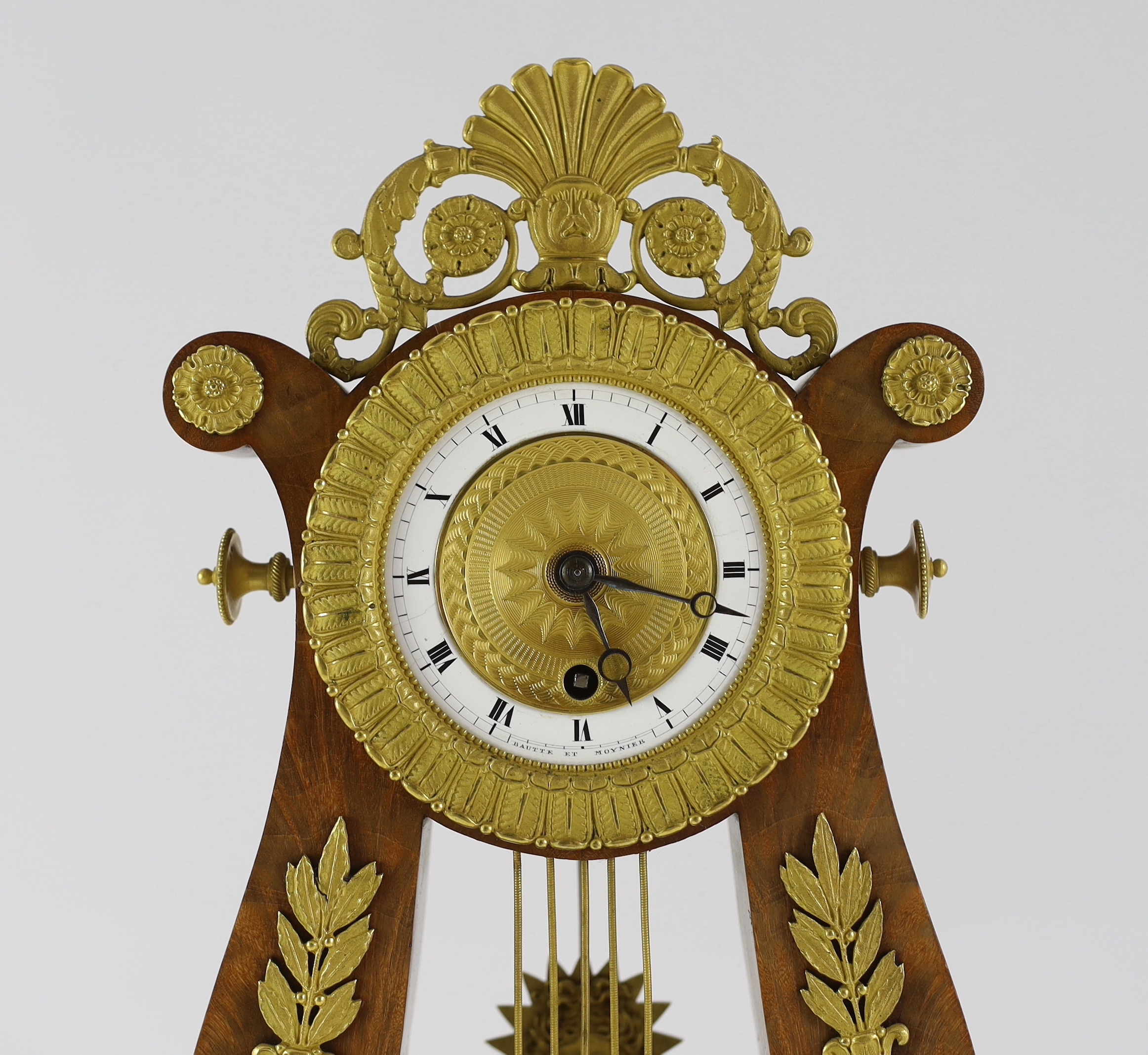 Bautte et Moynier. An early 19th century Swiss ormolu mounted mahogany lyre shaped mantel timepiece